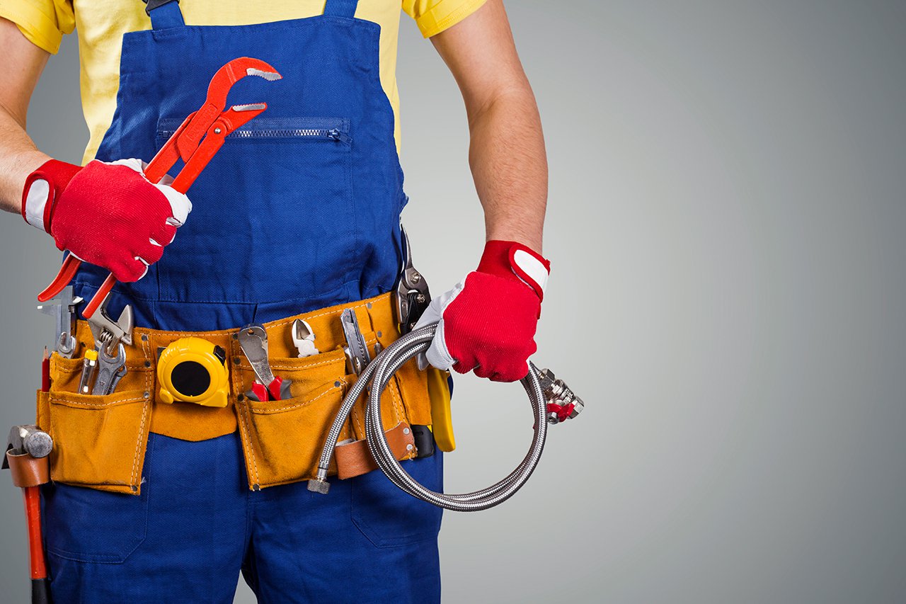 plumber-with-tool-belt-isolated-on-gray